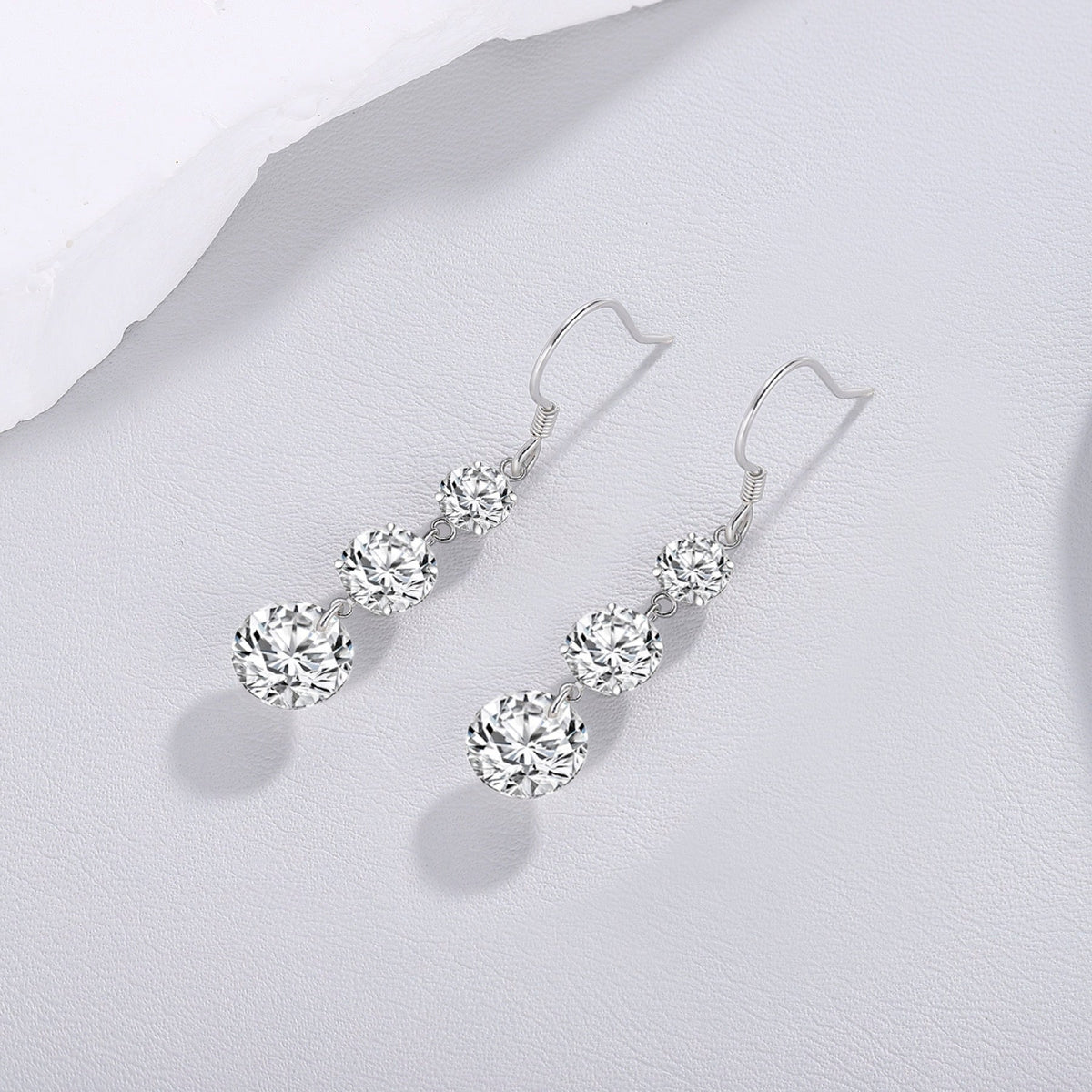 Tiered Moissanite Three-Stone Drop Earrings in Sterling Silver