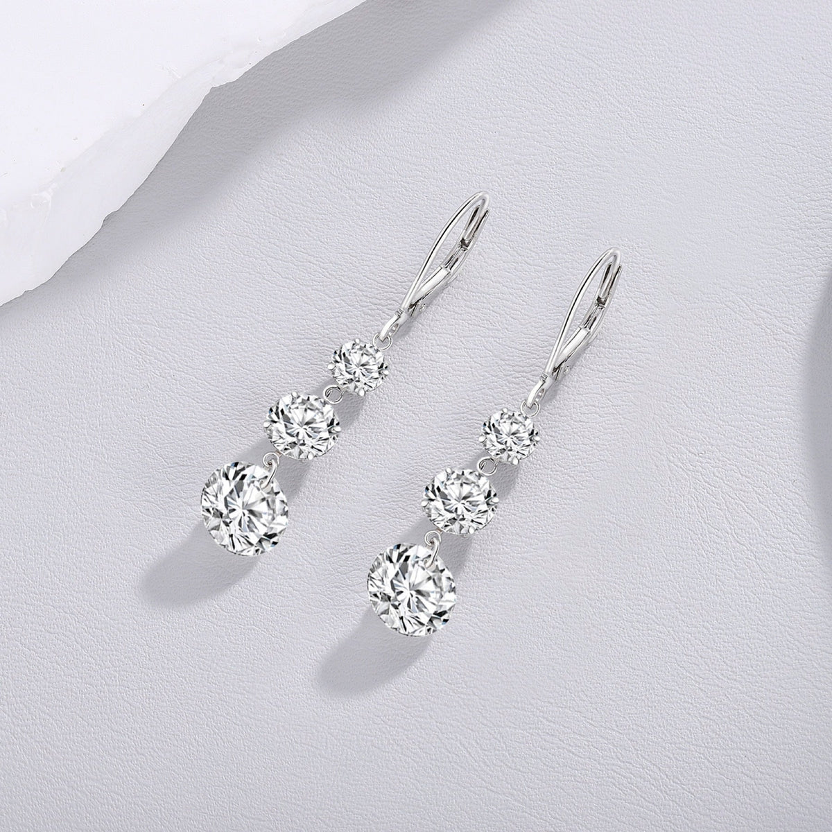 Graduate Moissanite Three-Stone Drop Earrings in Sterling Silver