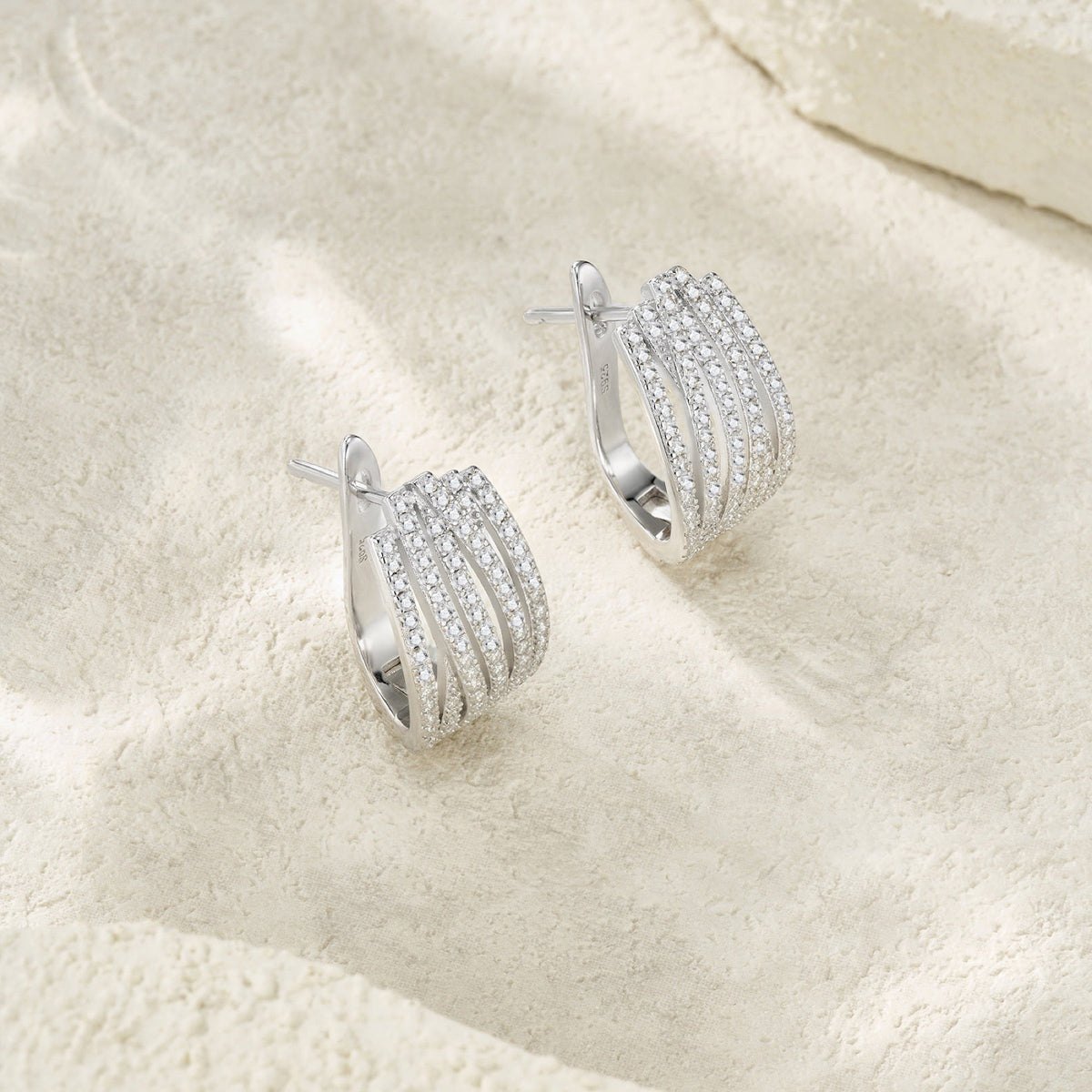 Fascia Moissanite Huggie Hoop Earrings in Sterling Silver