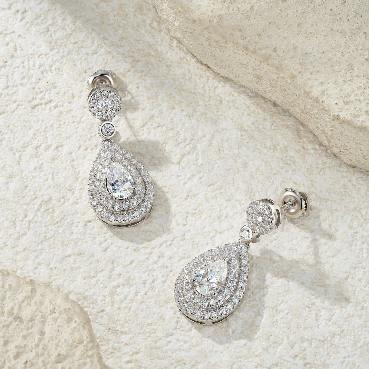 Duegocce Pear-Cut Moissanite Drop Stud Earrings in Sterling Silver